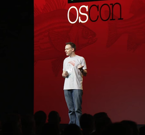 on stage at OSCON